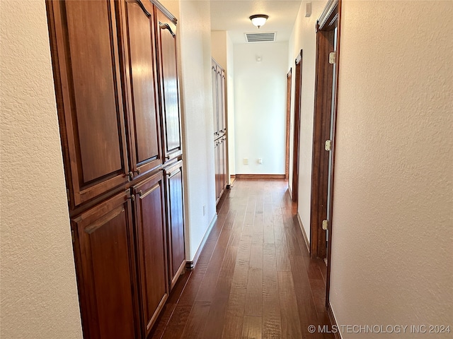 hall with dark wood-type flooring