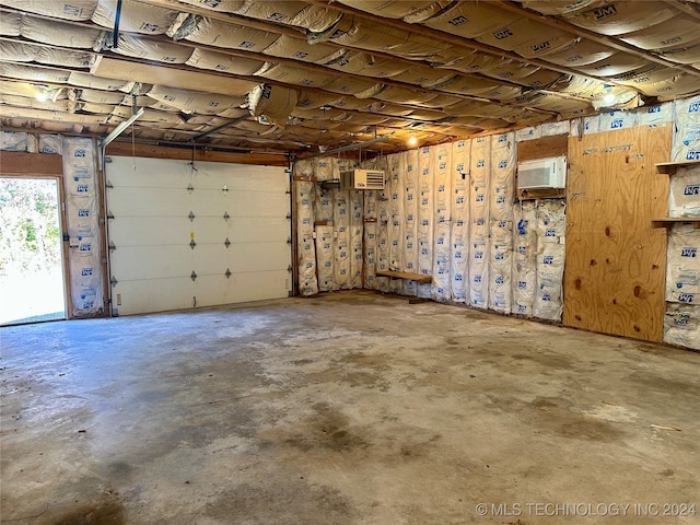 garage featuring an AC wall unit