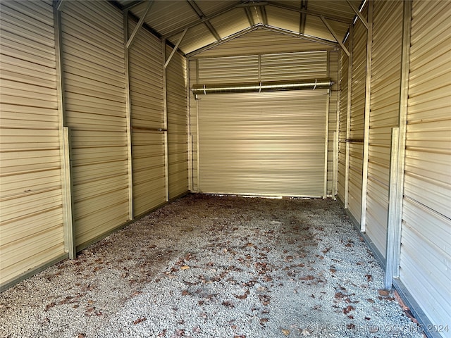 garage featuring wood walls