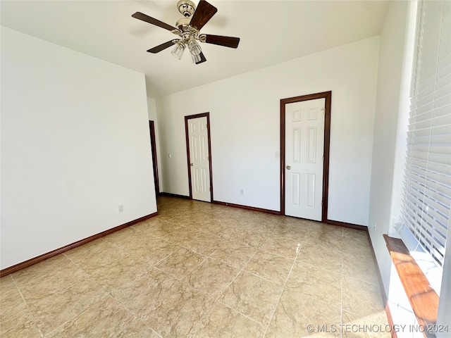 empty room featuring ceiling fan