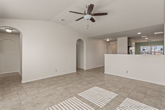 spare room featuring ceiling fan and lofted ceiling