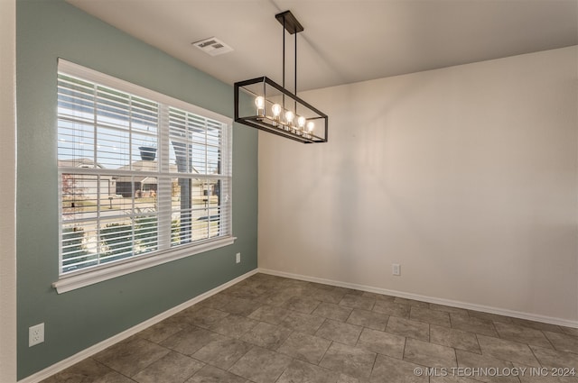 empty room with a chandelier