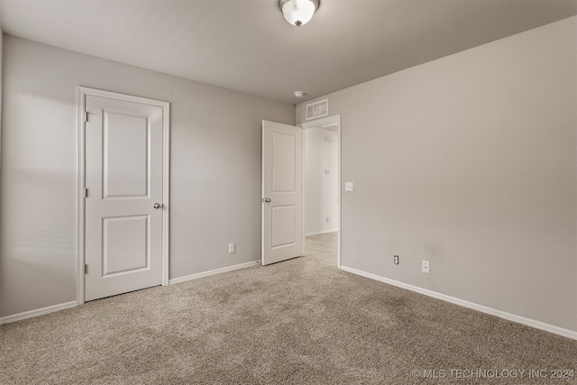 unfurnished bedroom featuring carpet