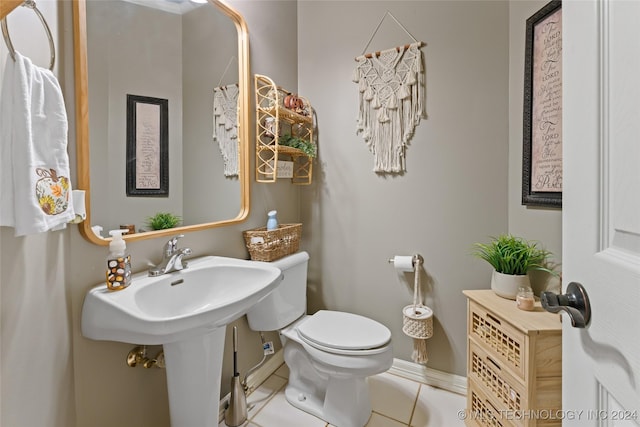 3103 Callaway Dr, Claremore, OK 74019 - half bath with tile patterned floors, toilet, and baseboards
