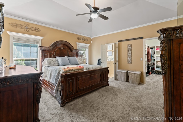 carpeted bedroom with ornamental molding, ensuite bathroom, ceiling fan, and lofted ceiling