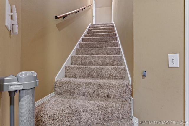 3103 Callaway Dr, Claremore, OK 74019 - stairway featuring baseboards and carpet floors
