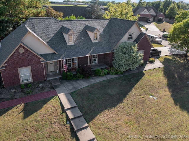 3103 Callaway Dr, Claremore, OK 74019 - view of front facade featuring brick siding, a shingled roof, and a front lawn