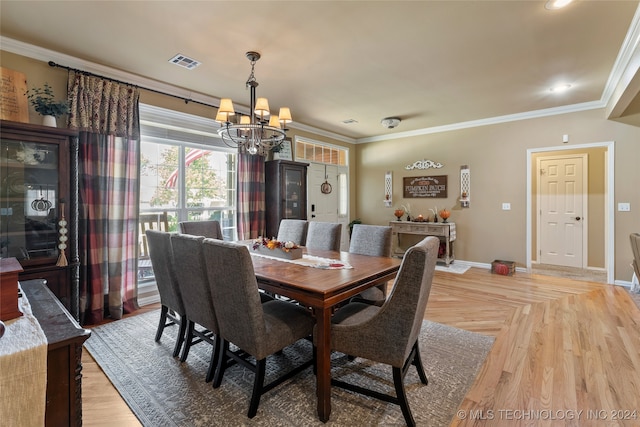 dining space with an inviting chandelier and crown molding