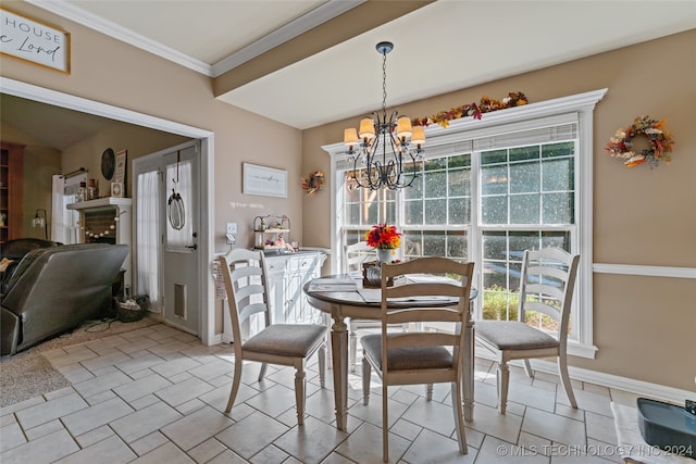 dining space with ornamental molding and an inviting chandelier