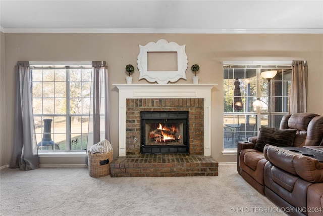 carpeted living room featuring crown molding and a brick fireplace