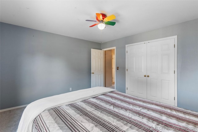 unfurnished bedroom featuring ceiling fan, a closet, and carpet floors