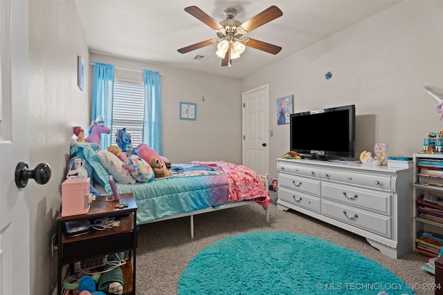 bedroom featuring ceiling fan and carpet