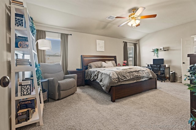 bedroom with ceiling fan, carpet floors, and vaulted ceiling