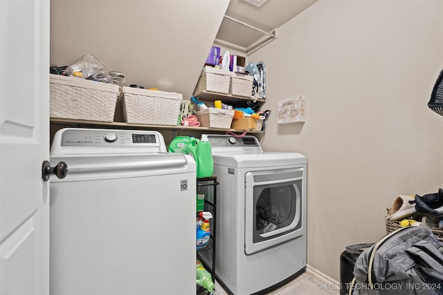 washroom featuring light tile patterned flooring and separate washer and dryer