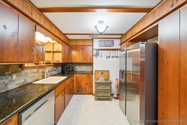 kitchen with stainless steel refrigerator with ice dispenser, dishwashing machine, sink, and backsplash