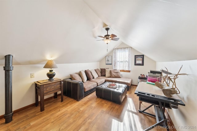 living room featuring vaulted ceiling, light hardwood / wood-style floors, and ceiling fan