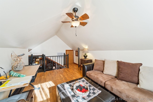 living room featuring lofted ceiling, wood-type flooring, and ceiling fan