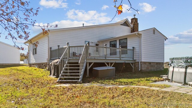 back of property with a wooden deck