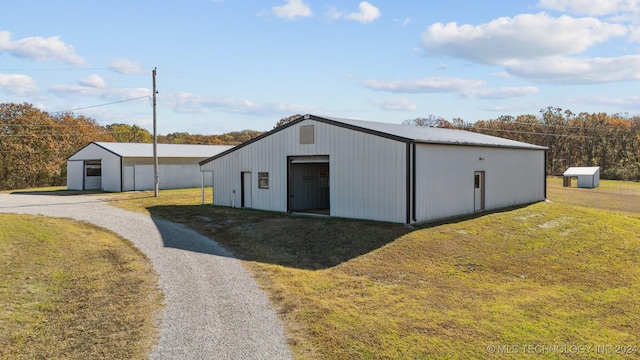 view of outbuilding featuring a lawn