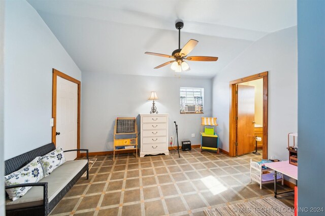 living area with lofted ceiling, cooling unit, and ceiling fan