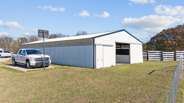 view of outbuilding with a lawn