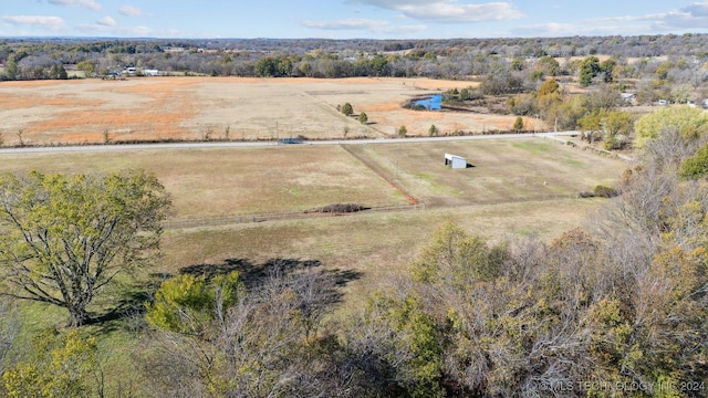 birds eye view of property featuring a rural view