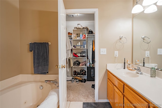 bathroom with vanity and a bathtub