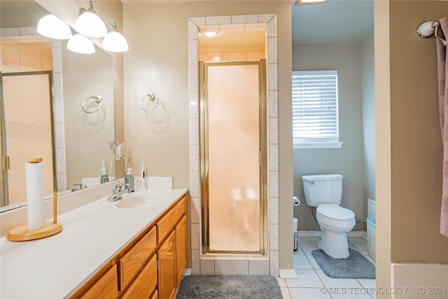 bathroom featuring a shower with door, vanity, tile patterned floors, and toilet