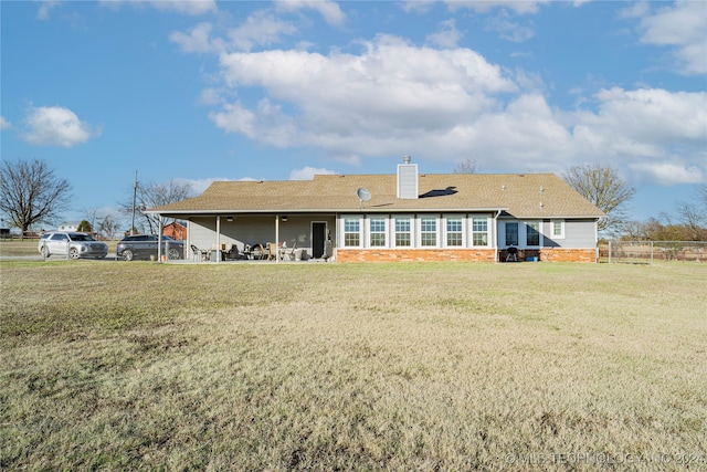 back of house with a yard