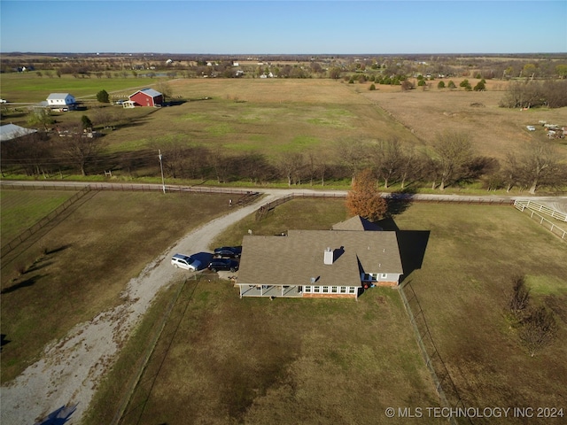 birds eye view of property with a rural view