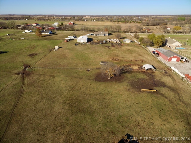 birds eye view of property featuring a rural view