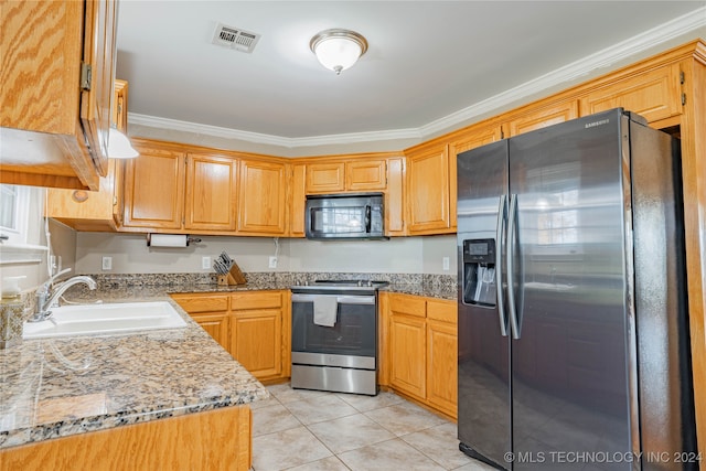 kitchen with ornamental molding, appliances with stainless steel finishes, and sink