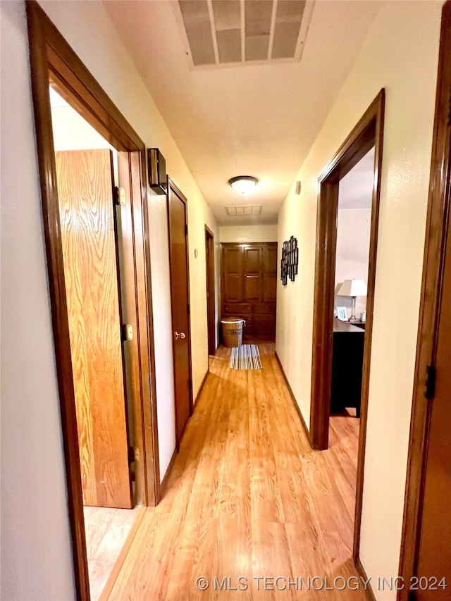 hall featuring light hardwood / wood-style flooring