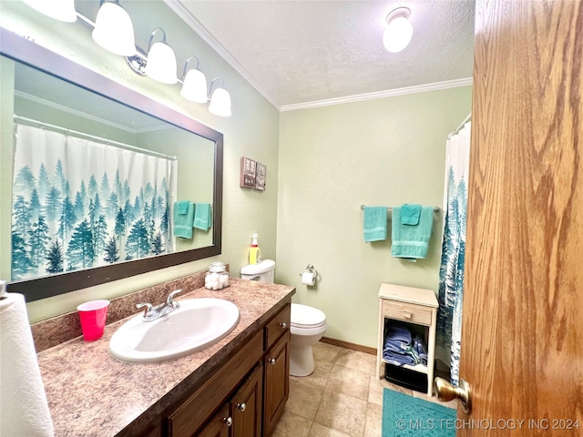 bathroom with tile patterned floors, ornamental molding, vanity, a textured ceiling, and toilet