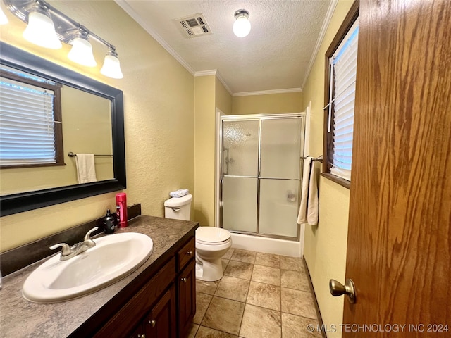 bathroom with crown molding, an enclosed shower, a textured ceiling, toilet, and vanity