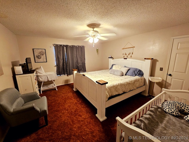 carpeted bedroom with ceiling fan and a textured ceiling