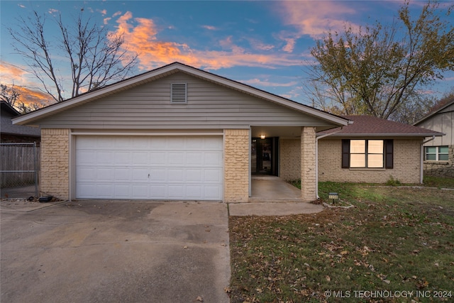 single story home featuring a garage