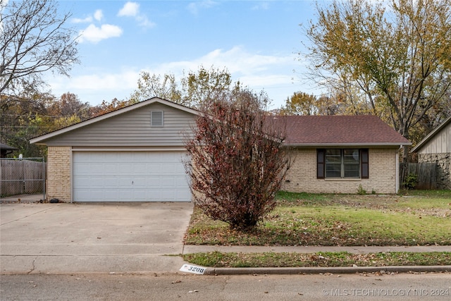 single story home with a garage