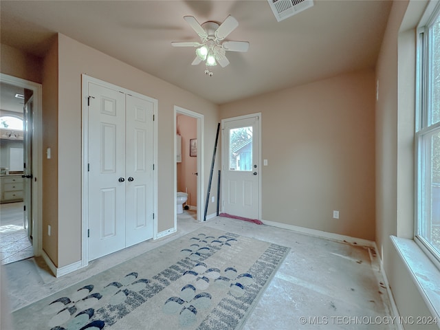 entrance foyer with ceiling fan