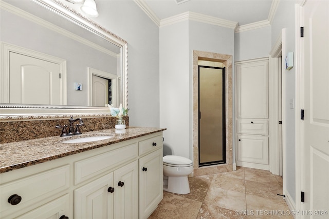 bathroom featuring vanity, toilet, ornamental molding, and walk in shower