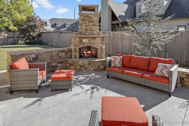 view of patio / terrace with an outdoor living space with a fireplace