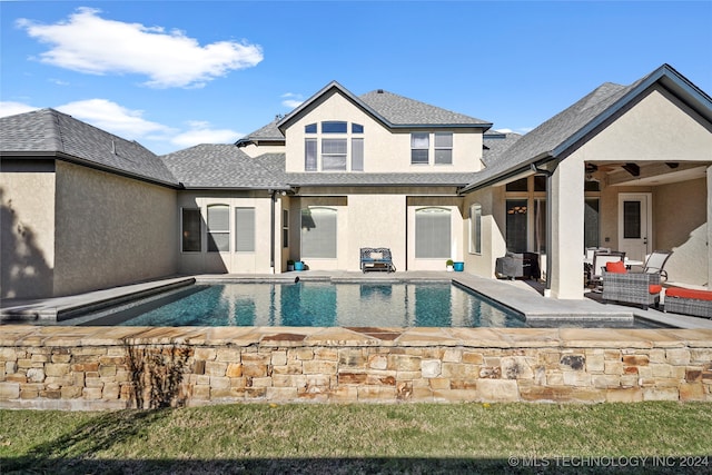 view of swimming pool featuring a patio area, ceiling fan, and an outdoor hangout area