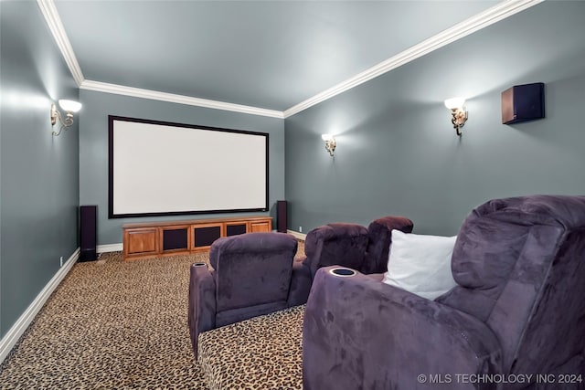 carpeted home theater room with ornamental molding