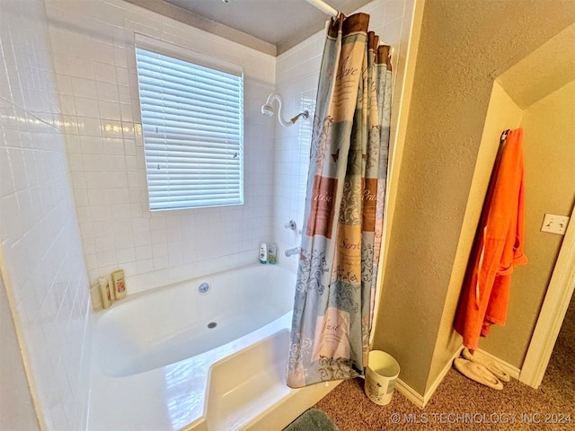 bathroom with shower / tub combo with curtain