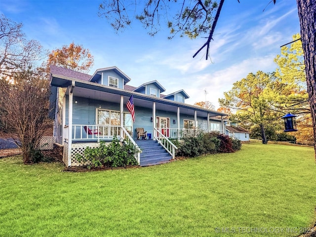 view of front facade featuring covered porch and a front yard