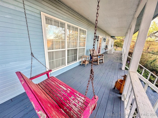 wooden deck featuring a porch