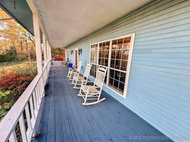 wooden deck featuring covered porch