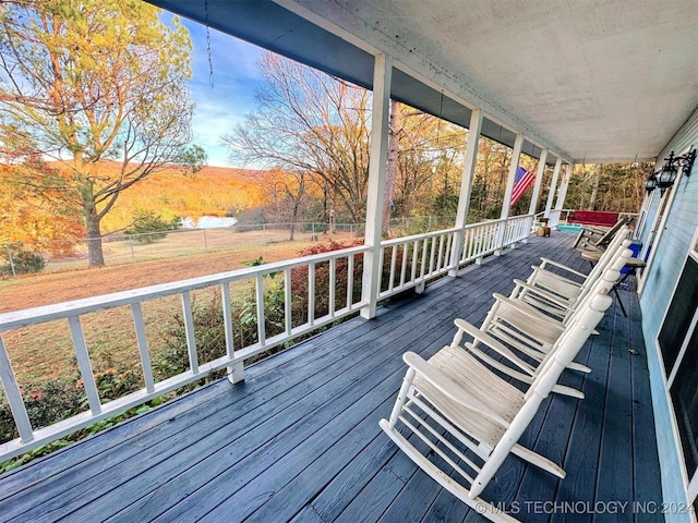 wooden deck featuring a porch