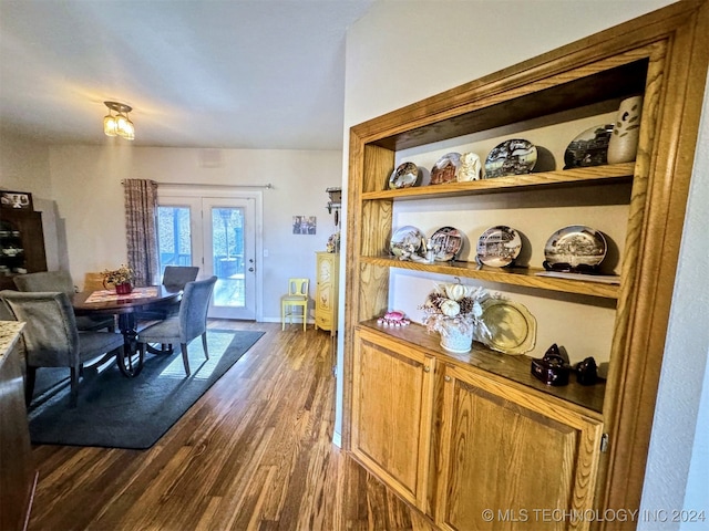 dining space featuring dark wood-type flooring and french doors