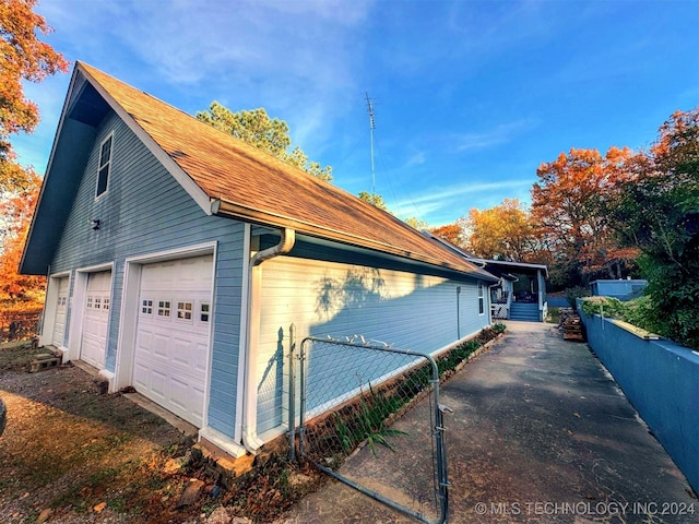 view of property exterior featuring a garage